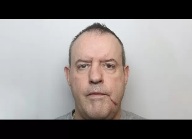 A murderer on parole made a death threat to a police officer.