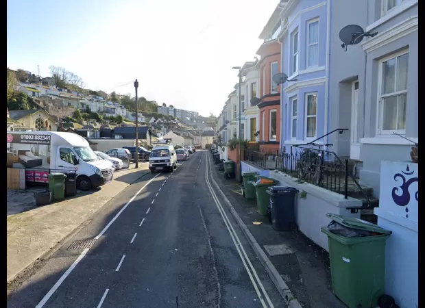 A 9-year-old boy dies after being spotted walking around the street and a man has been arrested.