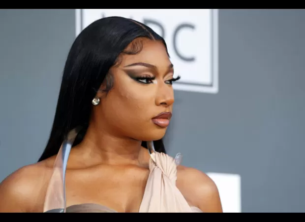 Security is increased at Megan Thee Stallion's mother's grave due to threats from Nicki Minaj's fans.