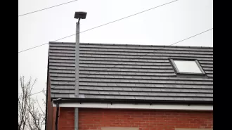 Residents are angry over builders putting a lamppost through the roof of a newly constructed home.