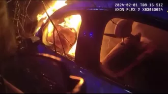 Police heroically save man from burning car in dramatic rescue.