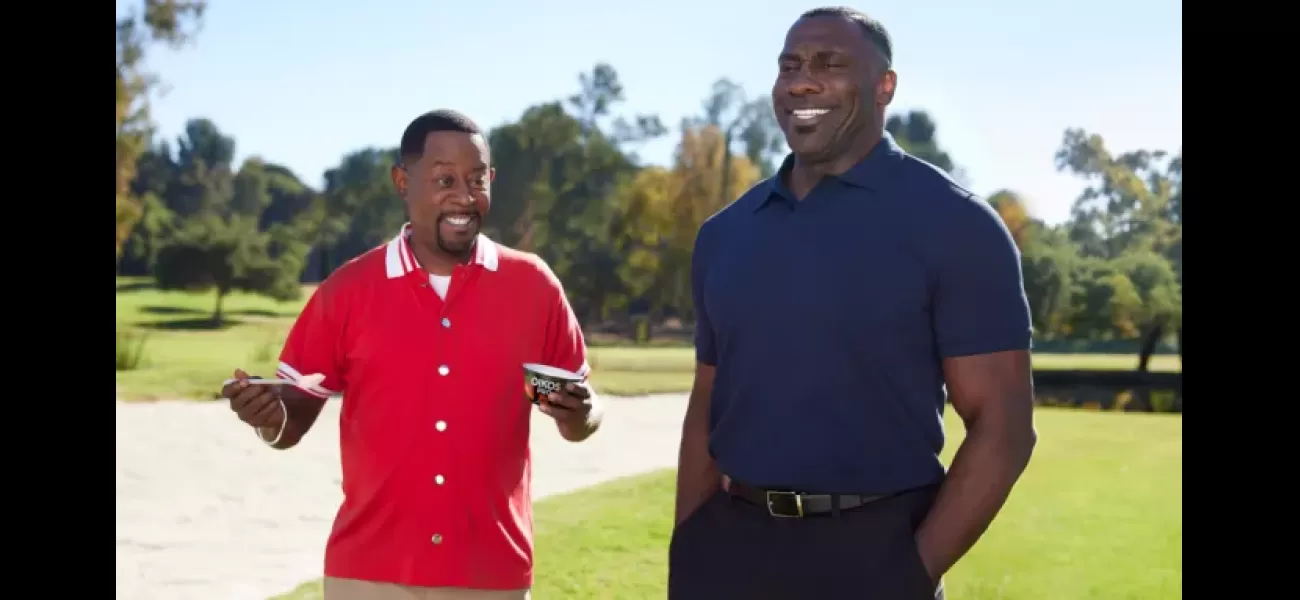Martin Lawrence shows off his muscles to impress Shannon Sharpe in an Oikos Super Bowl ad.