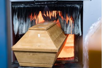 A woman unexpectedly revived while being transported in a hearse to her own cremation.