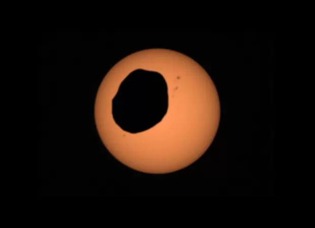 Catch a mind-blowing and bumpy solar eclipse on Mars.