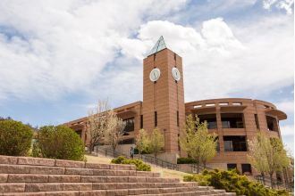 Police discovered two individuals deceased due to gunshot wounds in a dormitory at a university.