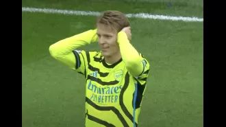 Arteta reaches out to Odegaard following his celebration during Arsenal's victory against Burnley.