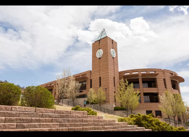 Police discovered two individuals deceased due to gunshot wounds in a dormitory at a university.