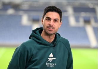 Arsenal's manager, Mikel Arteta, compliments a player from Porto before their upcoming match.