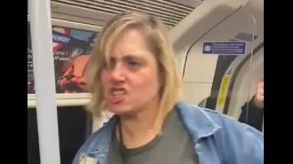 Woman angrily targets innocent person on train, demands they leave and makes racist comments.