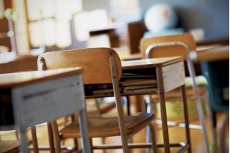 Controversy over removing 'colored' Black History decoration at Charlotte High School sparks social media debate.