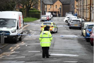 A 14-year-old boy is in critical condition after being stabbed while opening the door.