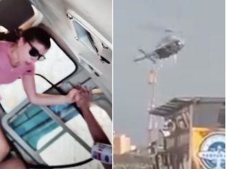 Tourist helicopter crashes into building after losing control.