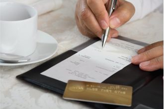 Atlanta eatery criticized for charging additional fees on customer's bill.