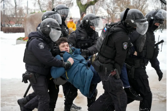 Wagner soldiers instructed to take flowers placed in memory of Alexei Navalny.