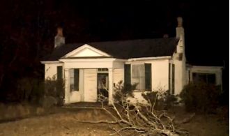 Father and son discover corpse while searching for treasure in deserted house.