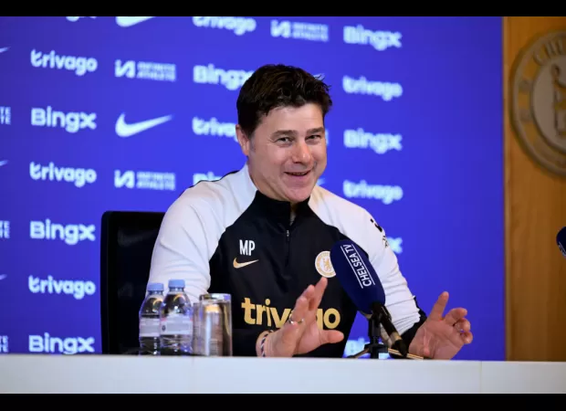 Soccer coach Pochettino criticizes his team's supporters for jeering a player from rival team Chelsea.