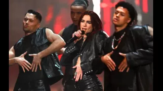 Dua Lipa's bold acrobatic performance starts off the Brit Awards in leather attire.