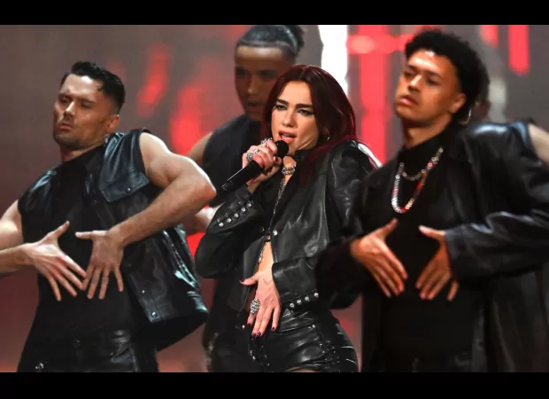 Dua Lipa's bold acrobatic performance starts off the Brit Awards in leather attire.