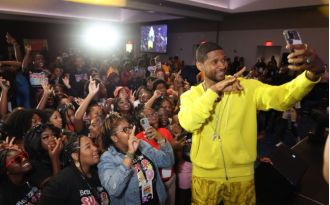 Usher's charity organization partners with IBM to teach AI to underprivileged youth.