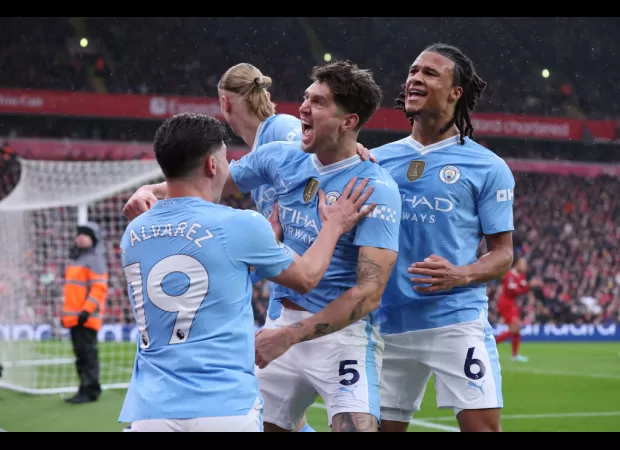 Liverpool and Manchester City tie in exciting match, Arsenal remains at top of standings.