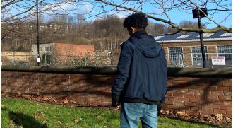 A young refugee claims to be a child, but the government believes they are 26 years old.