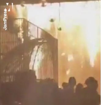 Massive blaze destroys wedding location when tent catches fire.