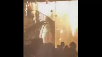 Massive blaze destroys wedding location when tent catches fire.