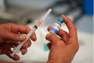 CDC warns of measles outbreak, recommends travelers and children get vaccinated.