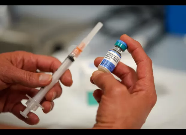 CDC warns of measles outbreak, recommends travelers and children get vaccinated.