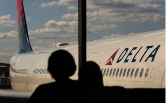Apple employee Wicliff Fleurizard accused of using child's boarding pass to sneak onto a Delta flight.