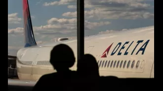 Apple employee Wicliff Fleurizard accused of using child's boarding pass to sneak onto a Delta flight.