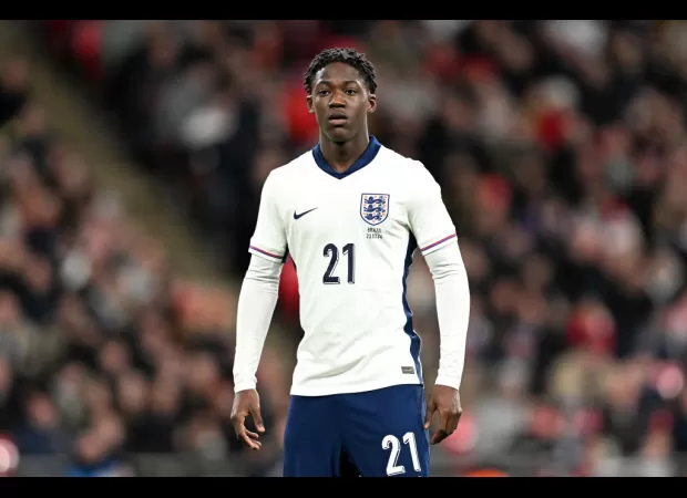 Portuguese soccer star Bruno Fernandes congratulates young Manchester United player Kobbie Mainoo on his debut with the England team.