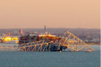 Baltimore bridge falls due to ship impact.