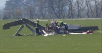 A private airplane crashes at museum airstrip while students watch.