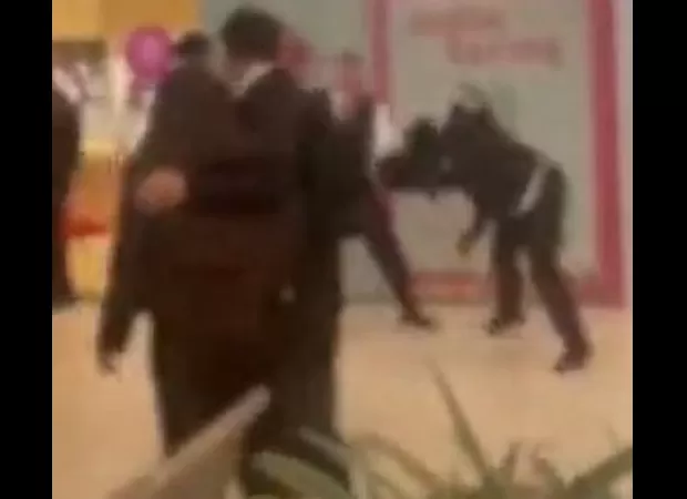 Chaotic scene as kids overrun mall, confront guards in loud, rowdy outburst.