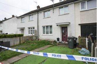Police have arrested a man in connection with the murder of a 48-year-old woman in a house.