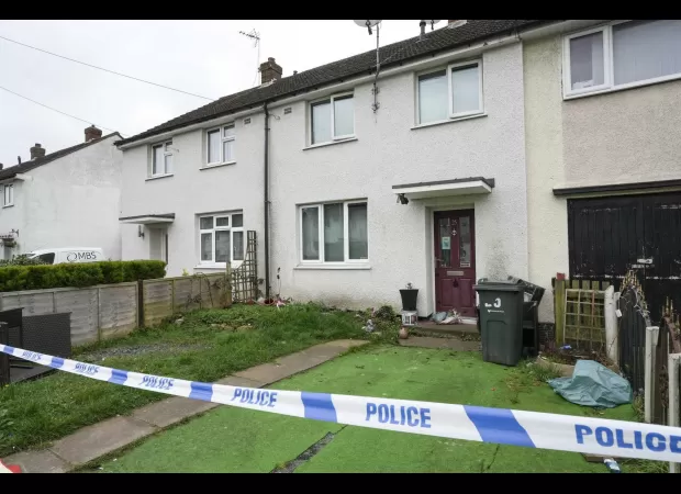 Police have arrested a man in connection with the murder of a 48-year-old woman in a house.