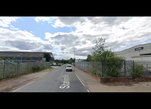 A paraglider narrowly avoids danger when he lands on a roof following a parachute malfunction.