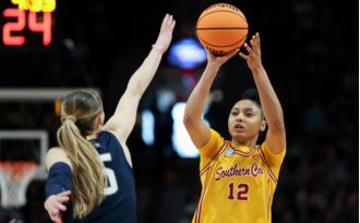 Freshman basketball star JuJu Watkins of USC breaks record for highest-scoring NCAA women's freshman player.