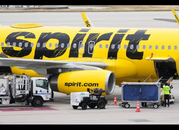 A female passenger caused a disturbance on a Spirit Airlines flight and shouted a racial slur at police officers.
