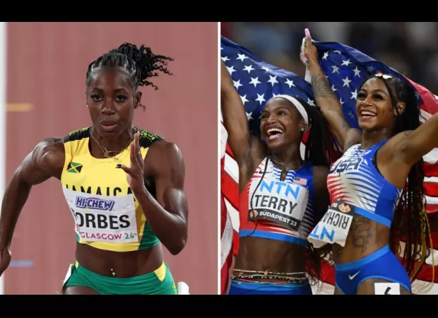 American runners help a hurt Jamaican sprinter at the USA vs. Jamaica track meet.