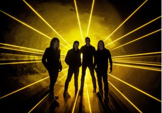 Rock icon gets tattoo with ashes of fellow legend as tribute to 80s metal band.