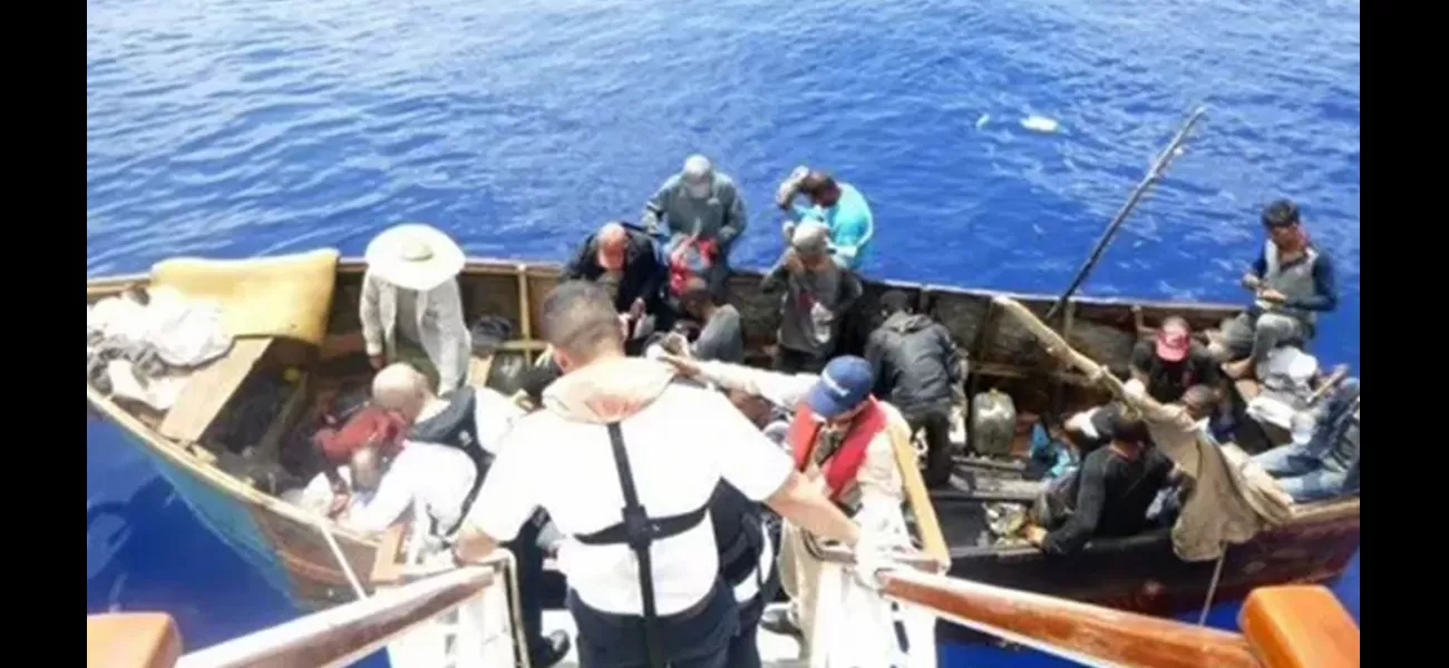 A cruise ship saves migrants from a small boat seeking assistance.