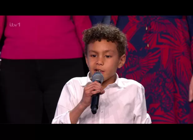 A young singer with a brain tumor moved Britain's Got Talent audience to tears as her choir received the Golden Buzzer.