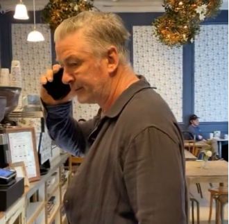 Alec Baldwin gets violent and punches camera in response to a woman's question about a previous incident involving a death.