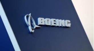 Boeing reports significant loss of $355 million in efforts to overcome recent crisis.