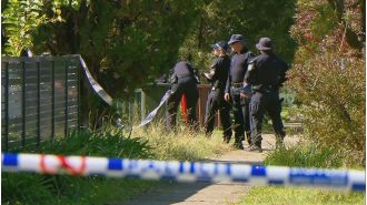 Police are looking into a stabbing incident where a man was found murdered on his neighbor's doorstep.