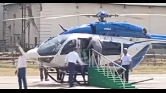 Mamata Banerjee stumbles while getting on helicopter.