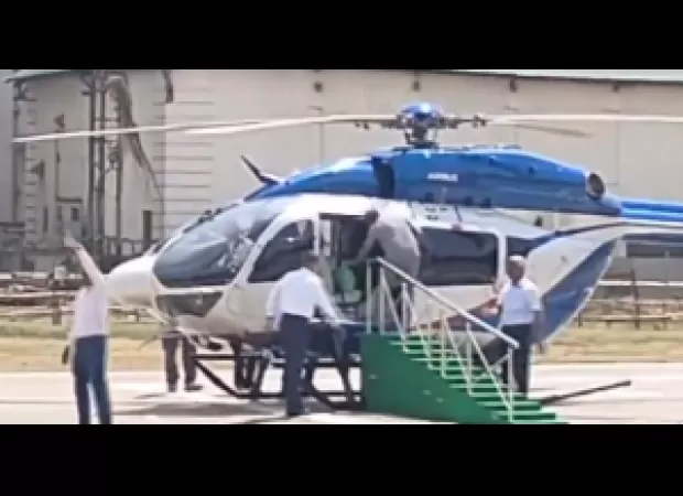 Mamata Banerjee stumbles while getting on helicopter.