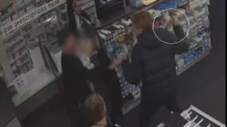 A father was reportedly attacked by a man wielding a knife at a pharmacy in Victoria.